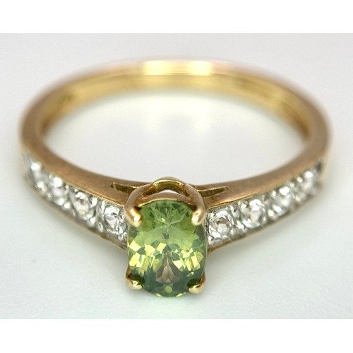 7 - Beautiful 9 CARAT GOLD and PERIDOT RING. Nicely set,having an oval cut PERIDOT mounted to top with W... 