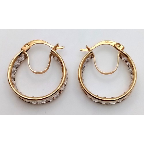 63 - Classic pair of 9 CARAT GOLD HOOP EARRINGS. Set with Emerald Cut Zirconia Gemstones. Full UK Hallmar... 