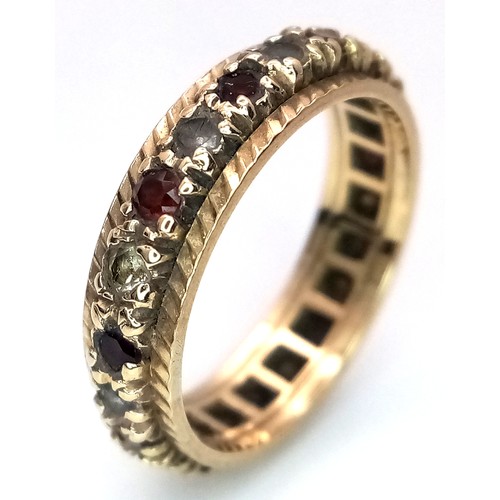 84 - Fabulous 9 CARAT GOLD BAND RING set with a full circle of Red and White gemstones. Full UK hallmark.... 