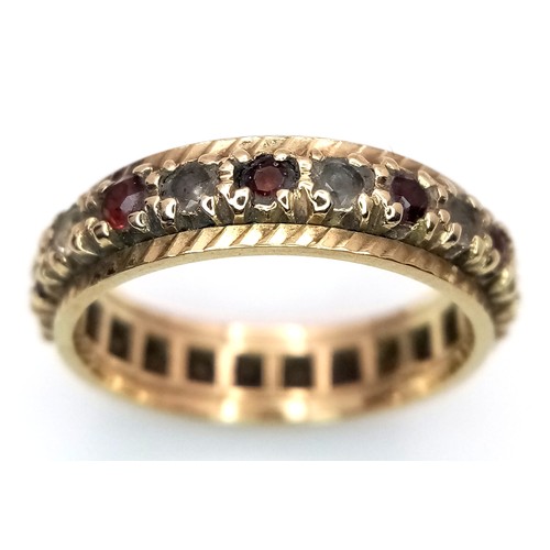 84 - Fabulous 9 CARAT GOLD BAND RING set with a full circle of Red and White gemstones. Full UK hallmark.... 