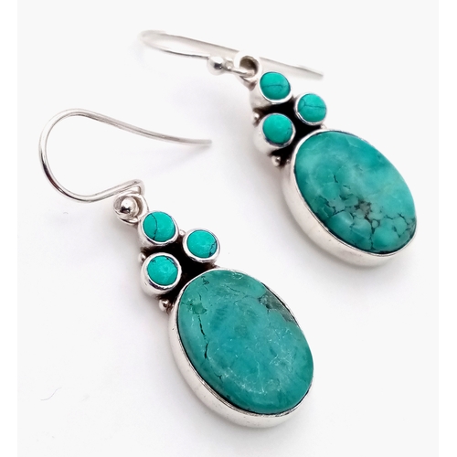 1302 - A Stylish Pair of Sterling Silver Turquoise Set Earrings. 3.2cm Drop. Earrings measure 1.2cm Wide.