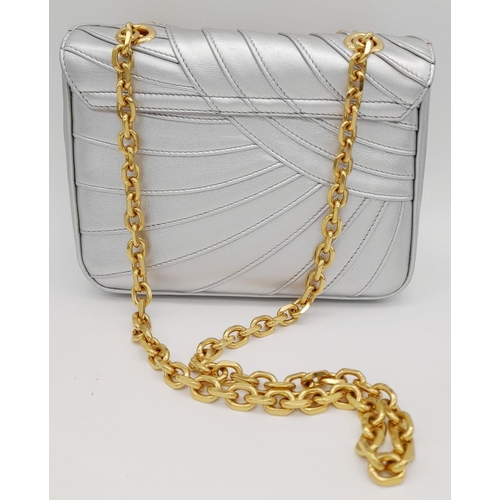 1173 - A Celine Metallic Silver Quilted Shoulder Bag. Metallic silver leather exterior with quilted detaili... 