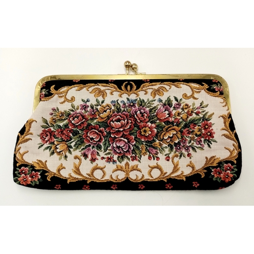 1416 - A vintage tapestry-style handbag featuring an ornate floral design with gold-tone metal frame and cl... 