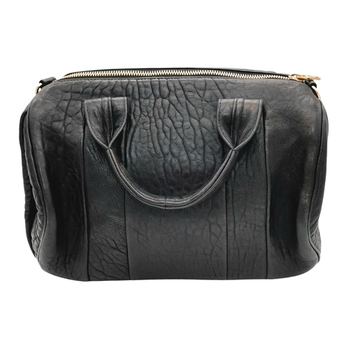 1208 - An Alexander Wang Pebbled Lambskin Rocco Bag. Black textured leather exterior with rose gold-toned h... 