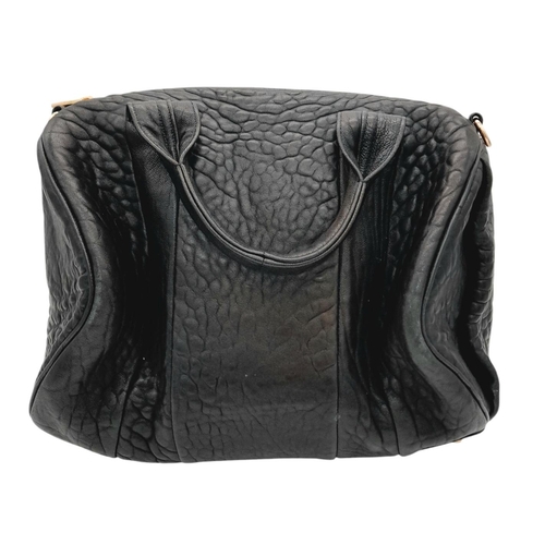 1208 - An Alexander Wang Pebbled Lambskin Rocco Bag. Black textured leather exterior with rose gold-toned h... 