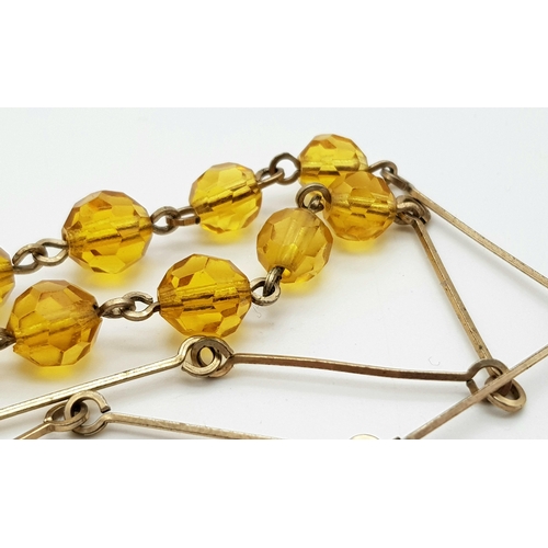 1324 - An Art Deco Gold Plated and Topaz Paste Necklace. 41cm.