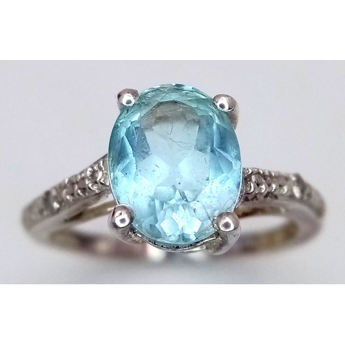 28 - Fabulous AQUAMARINE and DIAMOND RING. Consisting a large (1 carat) Oval Cut AQUAMARINE set in SILVER... 