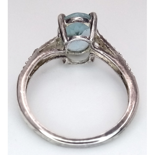 28 - Fabulous AQUAMARINE and DIAMOND RING. Consisting a large (1 carat) Oval Cut AQUAMARINE set in SILVER... 