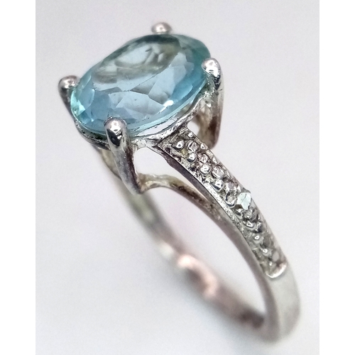 28 - Fabulous AQUAMARINE and DIAMOND RING. Consisting a large (1 carat) Oval Cut AQUAMARINE set in SILVER... 