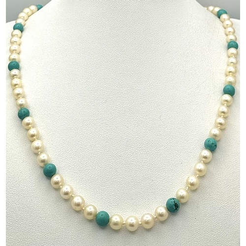 1303 - A Turquoise and Cultured Pearl Beaded Necklace. Gold filled and 9k clasp. 44cm