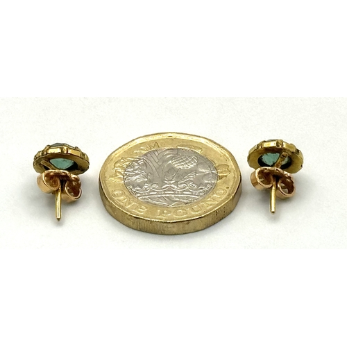 43 - A Pair of 18K Yellow Gold and Emerald Stud Earrings. 2.5g