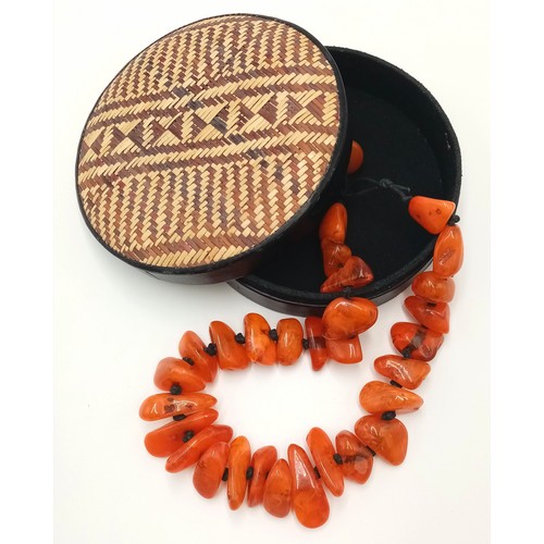 132 - A substantial, chunky necklace with orange amber resin nuggets from the Banjara tribes of Rajasthan,... 