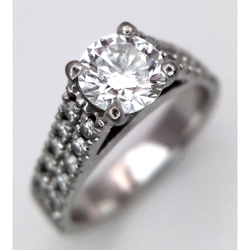 1202 - A GIA Certified 18K White Gold Diamond Ring. A 0.75ct brilliant round cut centre stone with VS1 clar... 