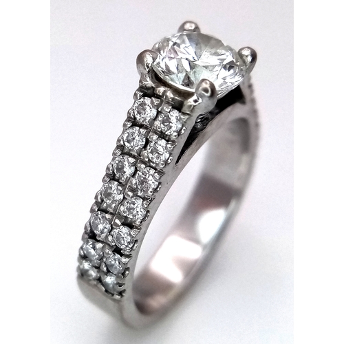 1202 - A GIA Certified 18K White Gold Diamond Ring. A 0.75ct brilliant round cut centre stone with VS1 clar... 