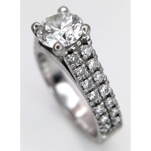 1202 - A GIA Certified 18K White Gold Diamond Ring. A 0.75ct brilliant round cut centre stone with VS1 clar... 