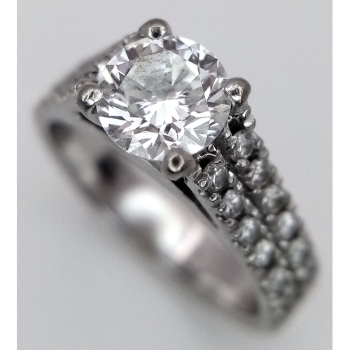 1202 - A GIA Certified 18K White Gold Diamond Ring. A 0.75ct brilliant round cut centre stone with VS1 clar... 