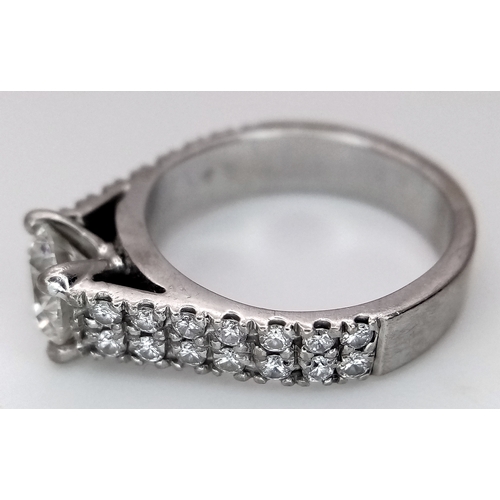 1202 - A GIA Certified 18K White Gold Diamond Ring. A 0.75ct brilliant round cut centre stone with VS1 clar... 