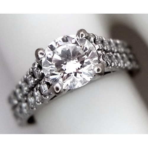 1202 - A GIA Certified 18K White Gold Diamond Ring. A 0.75ct brilliant round cut centre stone with VS1 clar... 