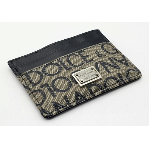 1635 - A Dolce and Gabbana Small Leather and Textile Wallet. 9.5cm x 7cm.