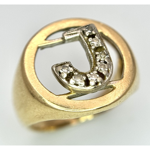 862 - A 9K Yellow Gold (tested), Initial 'J' Signet Ring. White stone decoration. Size G. 4g.