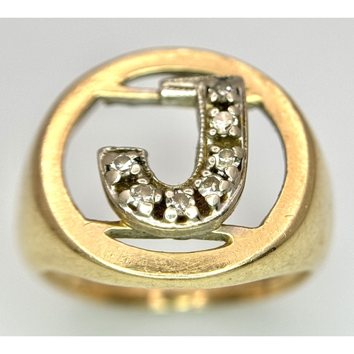 862 - A 9K Yellow Gold (tested), Initial 'J' Signet Ring. White stone decoration. Size G. 4g.