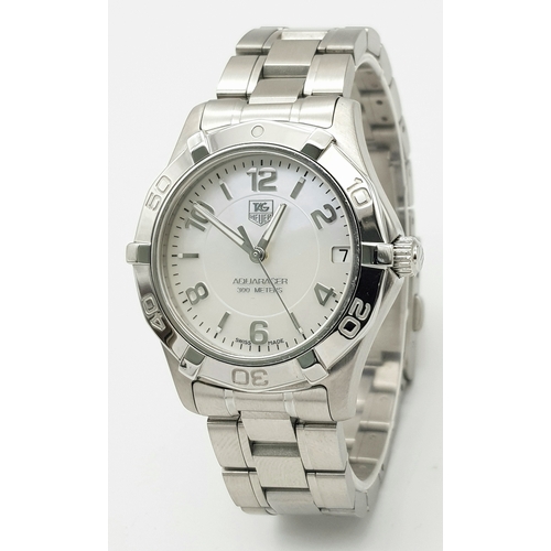 863 - A Tag Heuer 300M Aquaracer Divers Watch. Stainless steel bracelet and case - 34mm. White dial with d... 