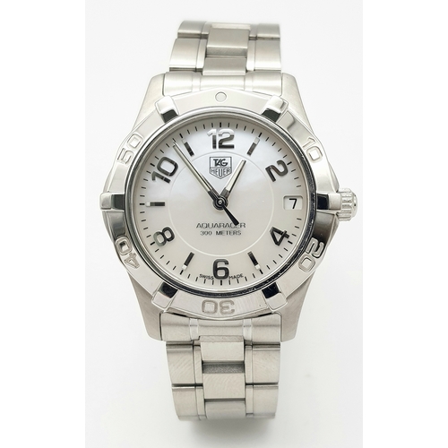 863 - A Tag Heuer 300M Aquaracer Divers Watch. Stainless steel bracelet and case - 34mm. White dial with d... 