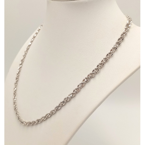 869 - A 9K White Gold Intricate Link Necklace. 42cm. 10.6g