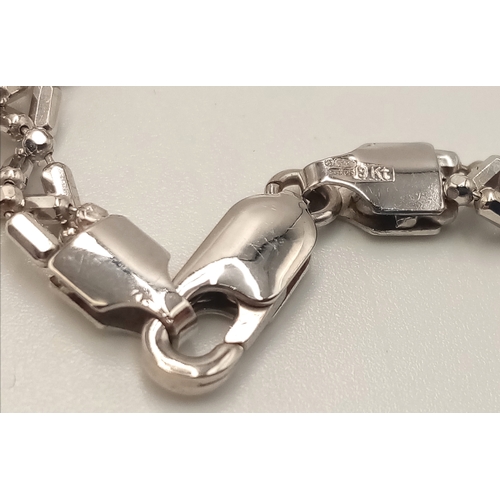 869 - A 9K White Gold Intricate Link Necklace. 42cm. 10.6g