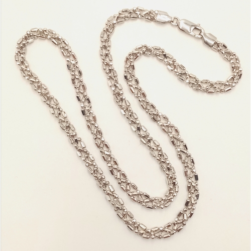 869 - A 9K White Gold Intricate Link Necklace. 42cm. 10.6g