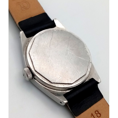 877 - A Vintage Tissot PR 516 Automatic Gents Watch. Black leather strap. Stainless steel case - 35mm. Sil... 