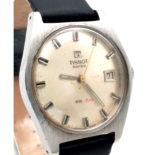 877 - A Vintage Tissot PR 516 Automatic Gents Watch. Black leather strap. Stainless steel case - 35mm. Sil... 