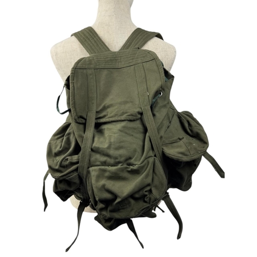 1207 - A Vietnam war era Vietcong Canvas Rucksack. Visible signs of wear, scuffs, and discoloration on exte... 