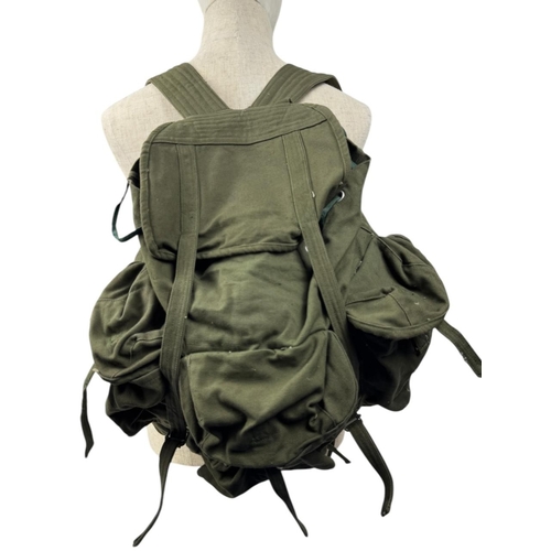 1207 - A Vietnam war era Vietcong Canvas Rucksack. Visible signs of wear, scuffs, and discoloration on exte... 