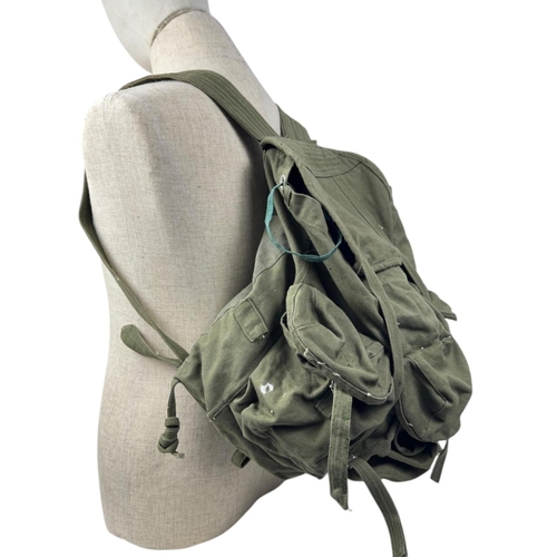 1207 - A Vietnam war era Vietcong Canvas Rucksack. Visible signs of wear, scuffs, and discoloration on exte... 