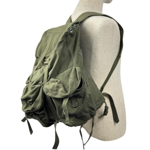 1207 - A Vietnam war era Vietcong Canvas Rucksack. Visible signs of wear, scuffs, and discoloration on exte... 