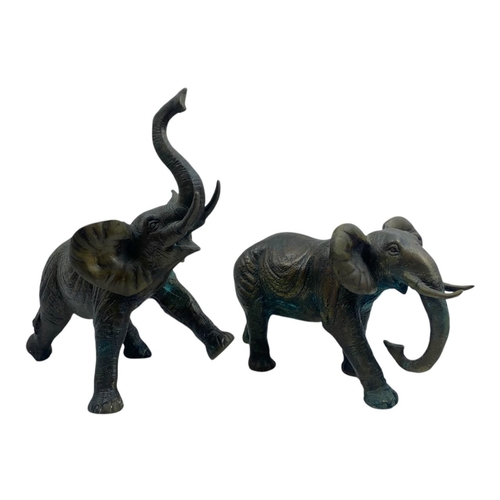 1304 - An antique Pair of Bronze Asian Elephant Sculptures. Patinated bronze exterior with intricate detail... 