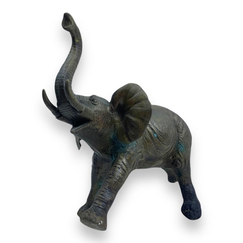 1304 - An antique Pair of Bronze Asian Elephant Sculptures. Patinated bronze exterior with intricate detail... 