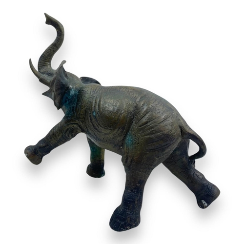 1304 - An antique Pair of Bronze Asian Elephant Sculptures. Patinated bronze exterior with intricate detail... 