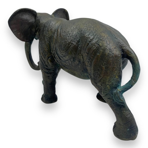 1304 - An antique Pair of Bronze Asian Elephant Sculptures. Patinated bronze exterior with intricate detail... 