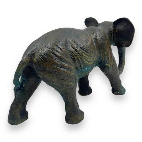 1304 - An antique Pair of Bronze Asian Elephant Sculptures. Patinated bronze exterior with intricate detail... 