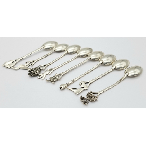 1150 - Seven Ornate 833 Silver Miniature Spoons. 8cm. 40g