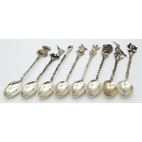 1150 - Seven Ornate 833 Silver Miniature Spoons. 8cm. 40g