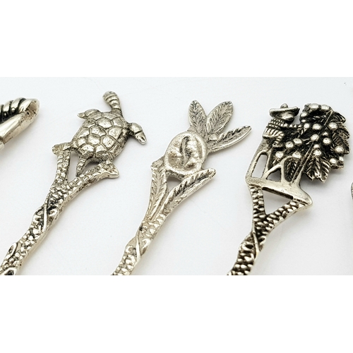 1150 - Seven Ornate 833 Silver Miniature Spoons. 8cm. 40g