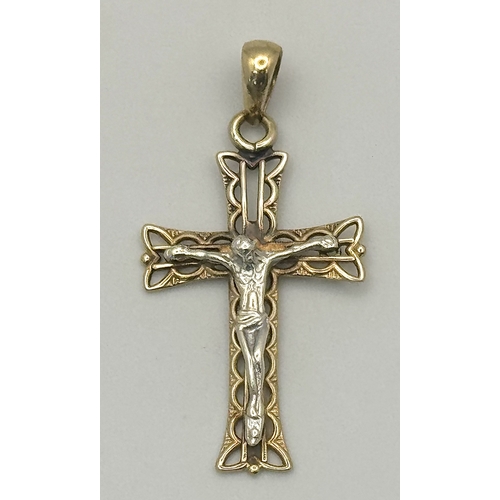 1299 - A 9K White and Yellow Gold Crucifix Pendant. 4cm. 1.4g. Ref: 620851