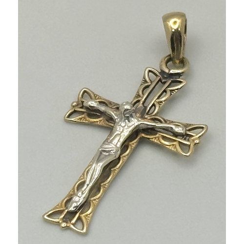 1299 - A 9K White and Yellow Gold Crucifix Pendant. 4cm. 1.4g. Ref: 620851