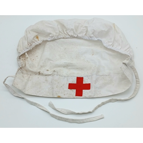 888 - An Original WWII German Red Cross DRK Helferin Nurse's head cover. Unissued War stock from a box tha... 