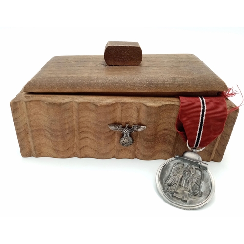 517 - A WW2 German Patriotic Box with an Eastern Front Medal inside.