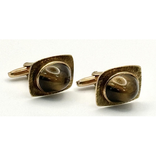 437 - A Pair of Vintage 9K Yellow Gold Tigers Eye Cufflinks. Brilliantly crafted with quality Tigers eye c... 