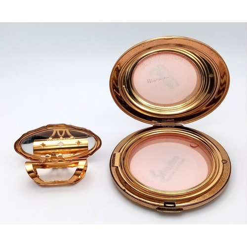 216 - A green enamelled and gilded HOUSE OF LORDS set of a powder compact with mirror and a lipstick case ... 